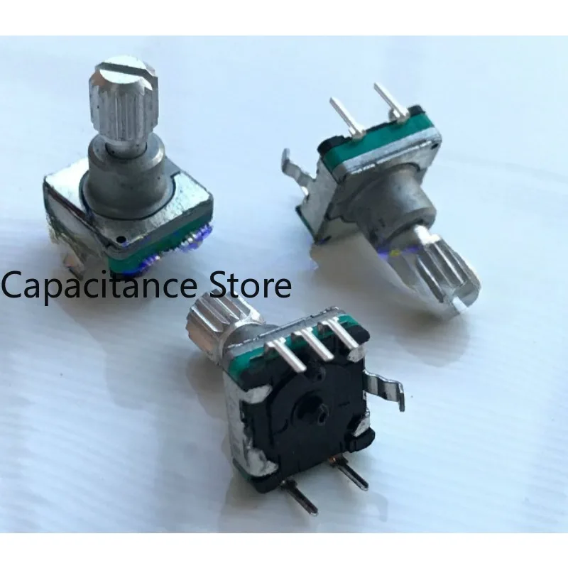 

5PCS EC11 encoder with push switch 18 positioning 9 pulse axis length 13MM.