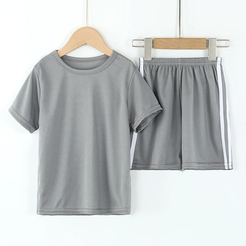 Children\'s summer thin quick-drying short-sleeved shorts two-piece boys and girls solid color loose leisure sports suit.