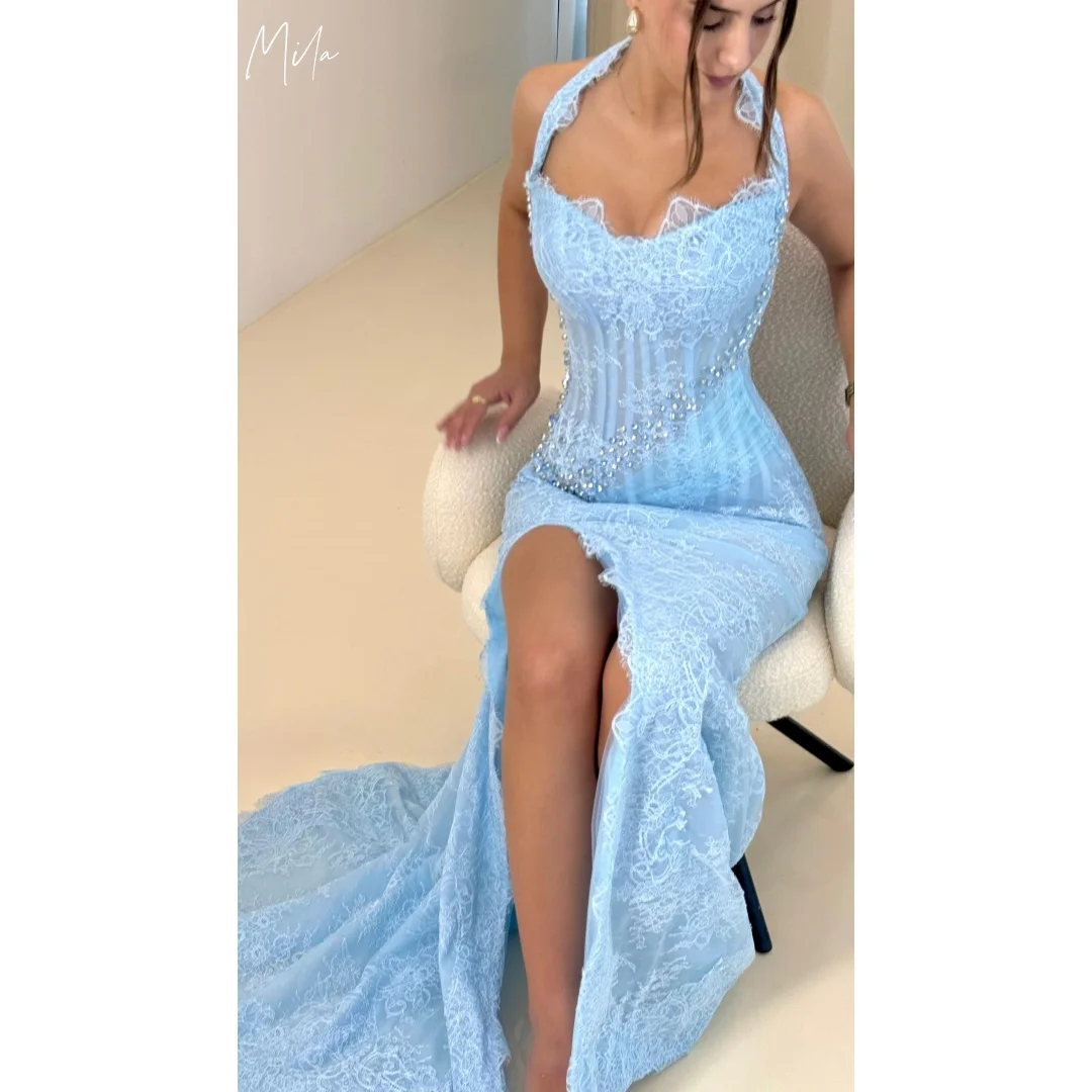 ชุดราตรีสีน้ำเงินมิลา แบบผูกคอ ผ่าข้าง ประดับกลิตเตอร์ ตัดเย็บตามสั่ง ชุดราตรีออกงาน แบบไร้สาย เปิดหลัง ชายกระโปรงยาว  ชุดราตรีหรูหรา ปี 2025