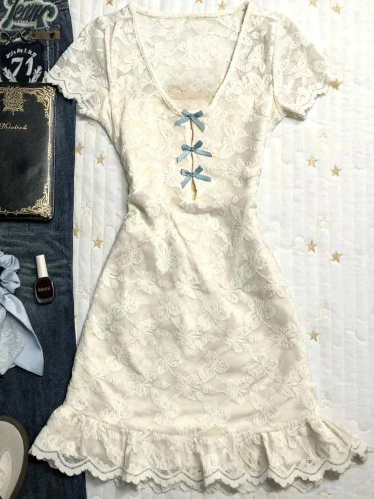 Oryginalna, vintage'owa koronkowa spódnica z kokardą w talii, dekoltem w serek lub okrągłym, damska spódnica bazowa, krój A, codzienna, elegancka.