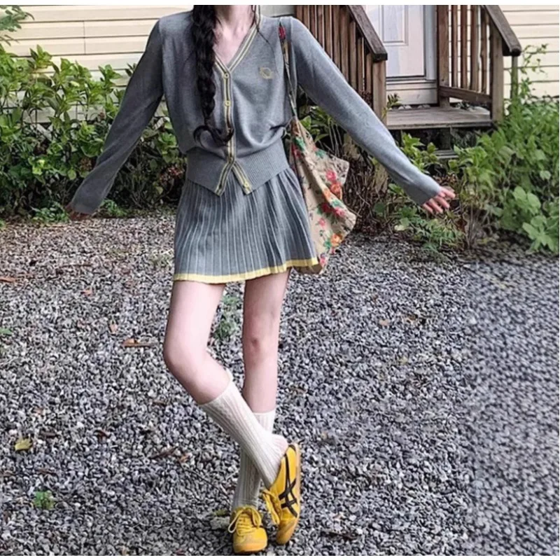 A Complete Set of Age-reducing Early Autumn  Korean-style Designed Gray V-neck Knitted Cardigan Top with Pleated Short Skirt Set