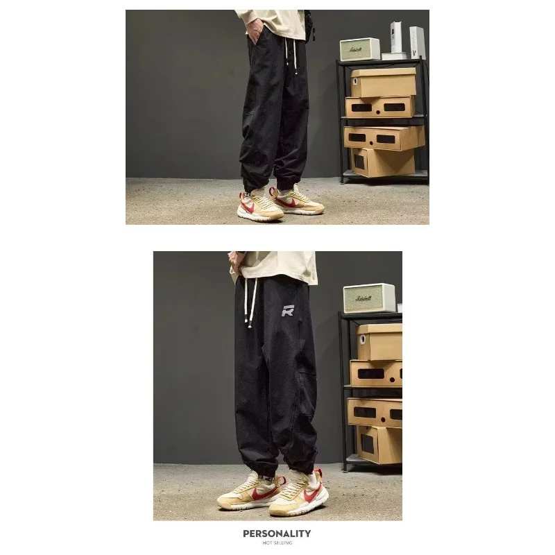 男性用レトロルーズカジュアルレギュラートレンディブランド厚手カジュアル秋冬パンツの新しいスタイルの足結び仕様