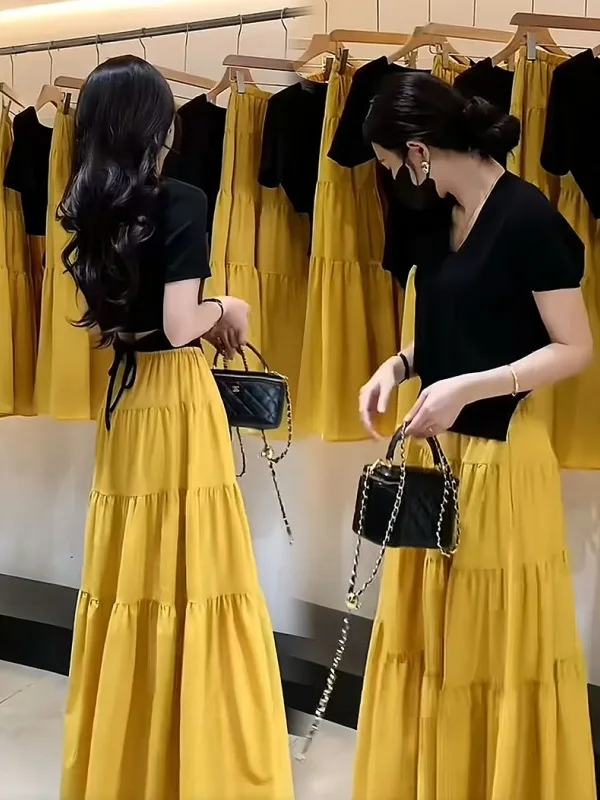 

Faionable Summer Outfit Women's T-irt And Skirt Set Hollow out Ba Strap Design Top f-length Skirt Two-piece Set