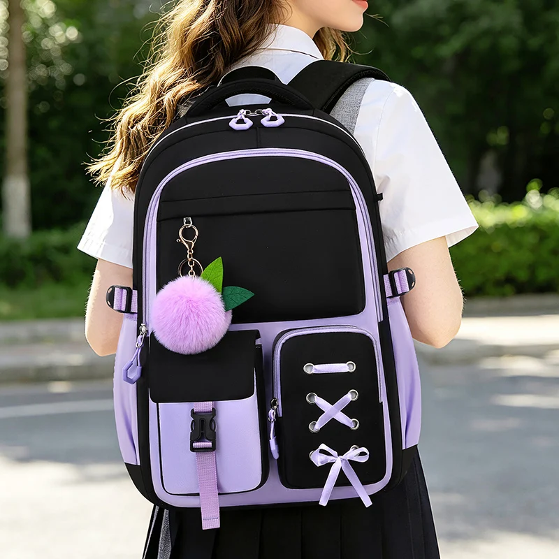 Children's backpack for girls with large capacity spine protection and reduced load waterproof and cute bow design for backpacks