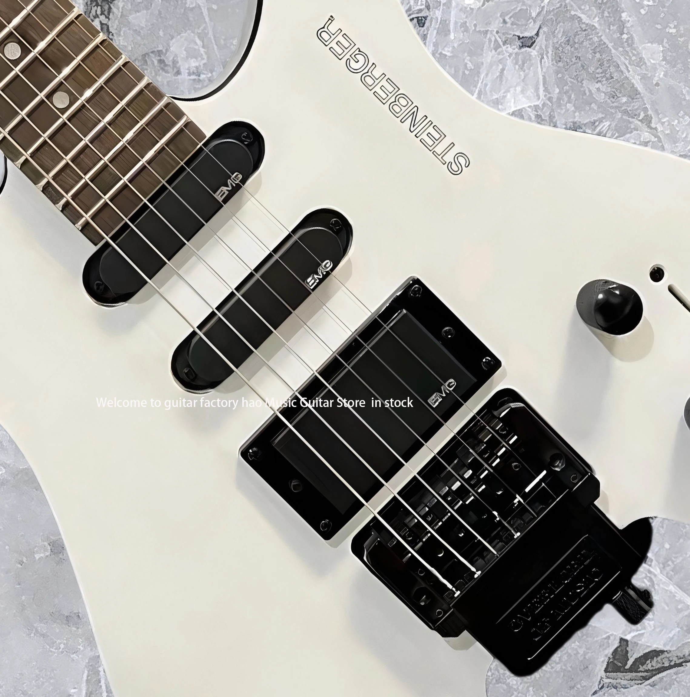 جيتار كهربائي بدون رأس، جسم الماهوجني، جسر فلويد روز تريمولو، جيتار مكون من 6 أوتار، إصدار شتاينبرغ