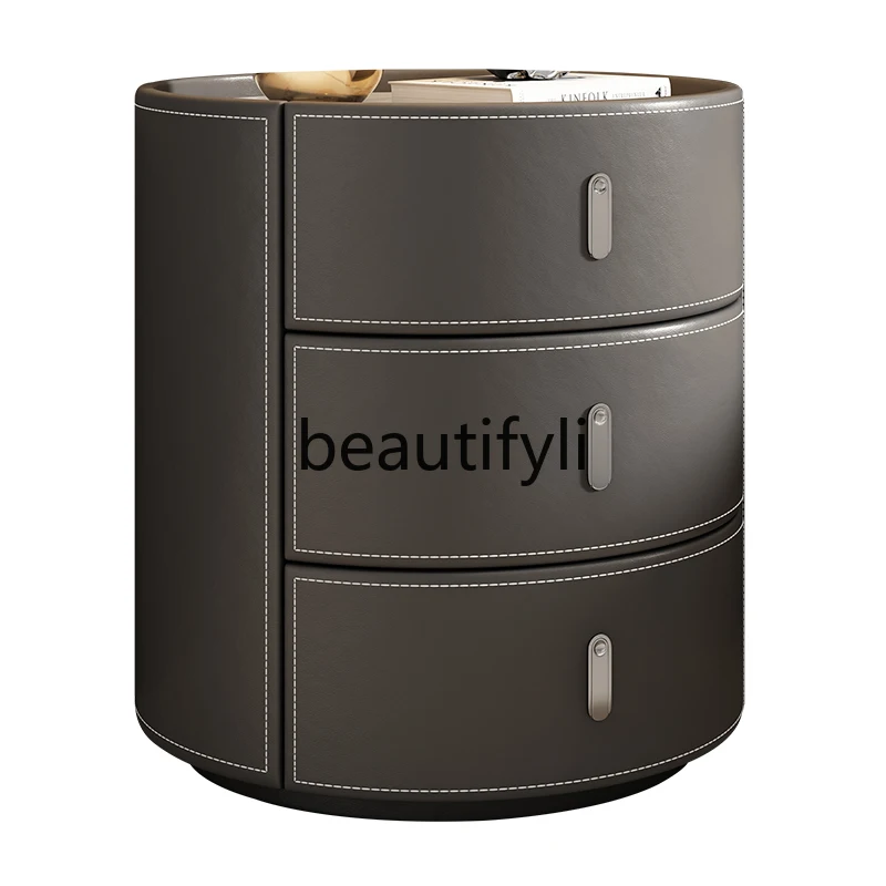 

Saddle leather bedside table Italian minimalist bedroom creative light luxury rock slab solid wood high-end round bedside table