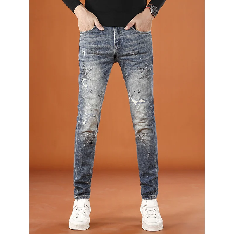 Pantalones rasgados de moda de alta gama para hombre, pantalones ajustados con diseño de estampado de moda elástica de otoño e invierno, 2025