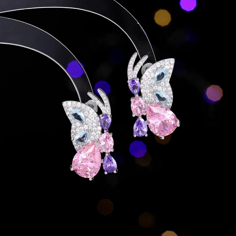 

The new s925 silver needle niche earrings are resplendent with zircon inlaid butterfly stud earrings flying side by side
