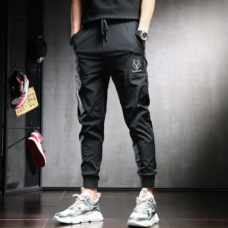 

2025 High end Men's Casual Pants Summer Thin Ice Silk Breathable Slimming Foot Tight Fast Drying Fashion Sports Pants