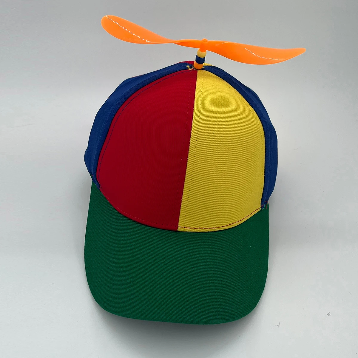 Colorful spiral propeller detachable baseball cap. Fun and fashionable style. Suitable for team building and outdoor outings.