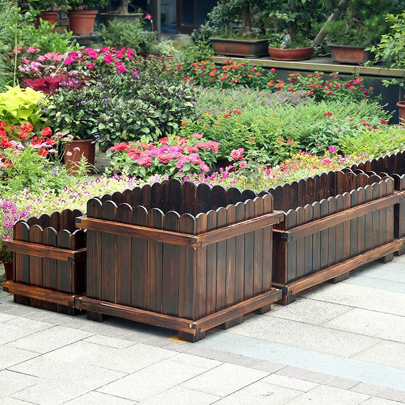 Anti-corrosion wood flower box carbonized solid wood planter outer frame round head flower pot factory direct supply plant