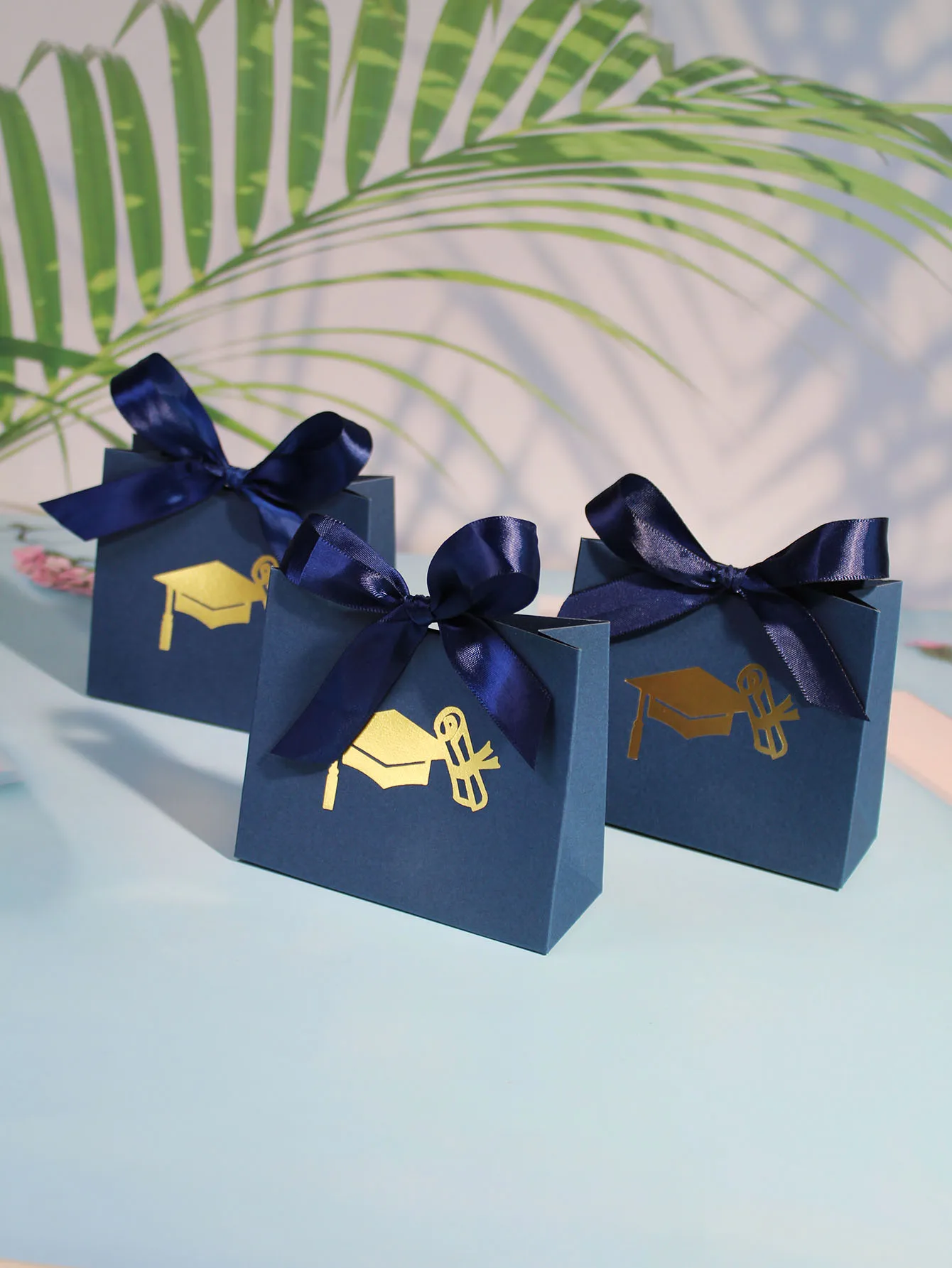 Elegant Navy Blue Graduation Gift Box with Gold Cap Design and Satin Ribbon - Perfect for Celebrating Educational Milestones