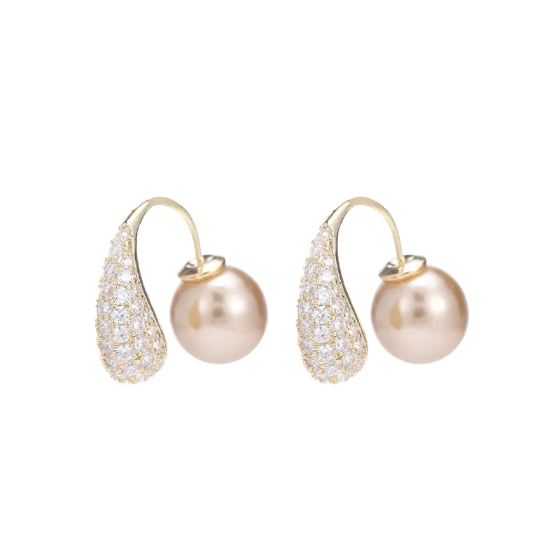 Il pendente, gli orecchini dal design di nicchia sono trendy, alla moda, eleganti e semplici, con un gancio per l'orecchio circolare e versatile