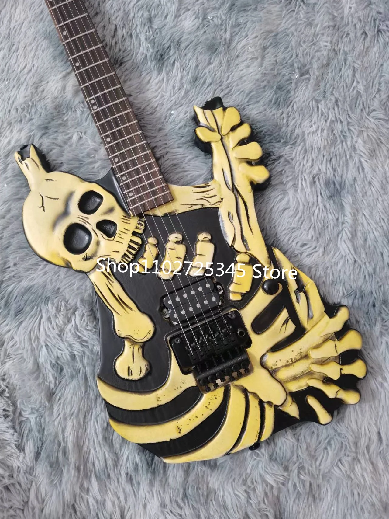 6-string skull electric guitar, maple fingerboard, silver accessories, tremolo system, free shipping