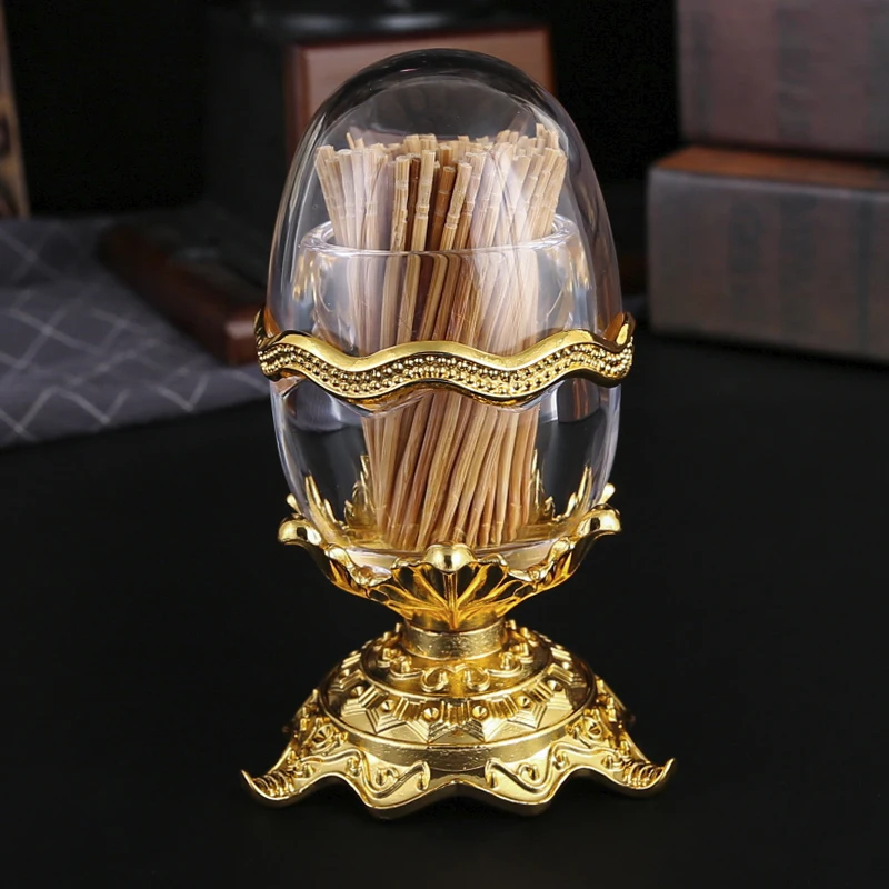 

1 metal toothpick holder with base, creative egg design, suitable for living room, dining room toothpick holder.