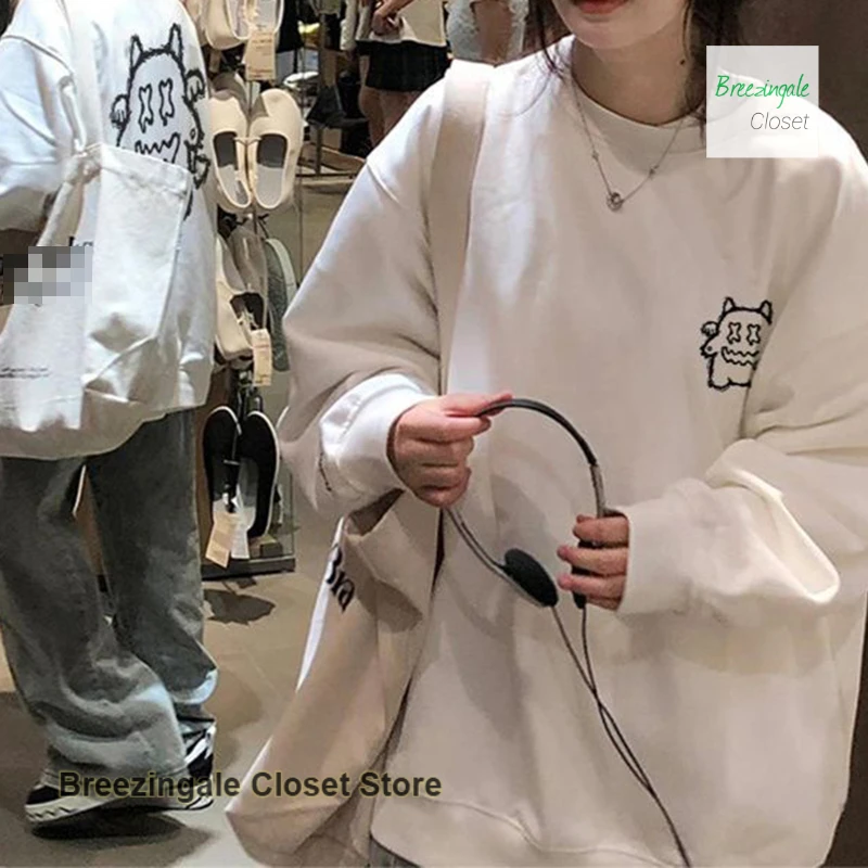 American-style cartoon little devil pattern hooded sweater white coat female spring and autumn loose fashion Joker casual top.