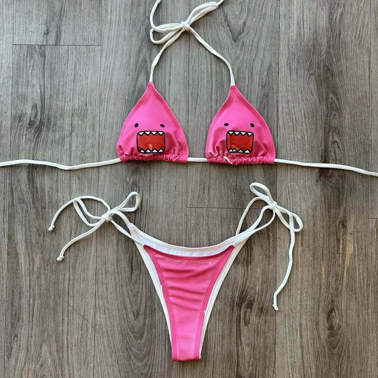 

2026 Summer New Cute Cartoon Domo Printed Triangular Cup Hanging Neck Strap Bikini Casual Set Spicy Girl Beach Swimsuit Trend
