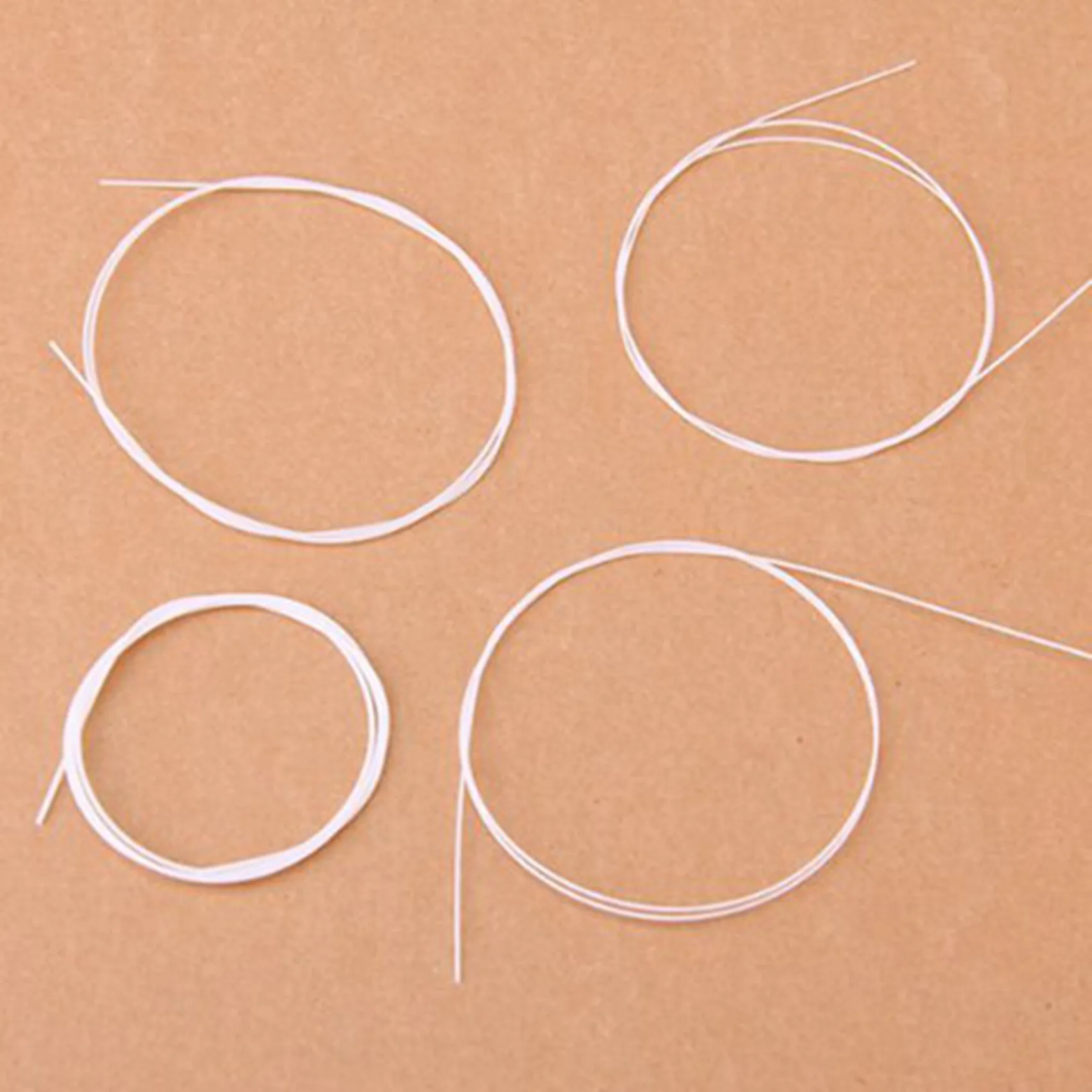 

AA75-12Pcs White Nylon Ukulele String Set