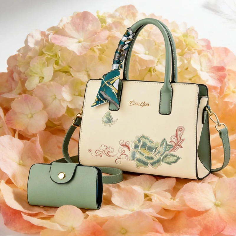 For a birthday gift, consider giving your mom a 2-piece set of handbags, including an embroidered handbag and a cross-body bag.