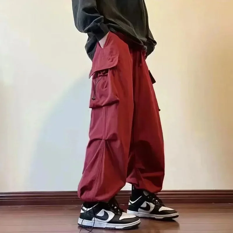 

2024 Harajuku Elastic Waist Side Pocket Tracksuit Pants Men Solid Cargo Pants Male Casual Hip Hop Drawstring Baggy Long Trousers