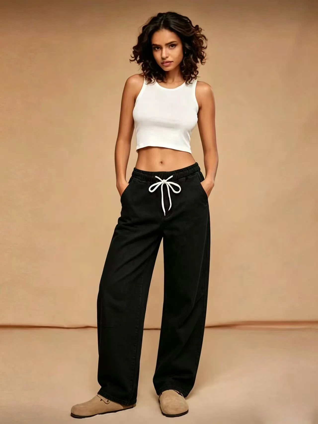 Women’s black curved-sword-style jeans with elastic waistband and drawstring, minimalist casual cropped pants