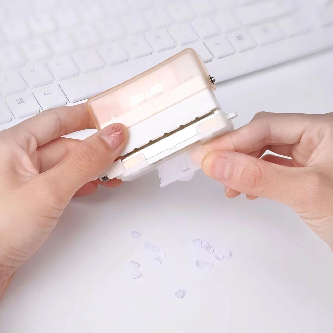 1PC portable multi-function 6-hole punch, mini handheld with built-in ruler and scrap container, suitable for DIY crafts.