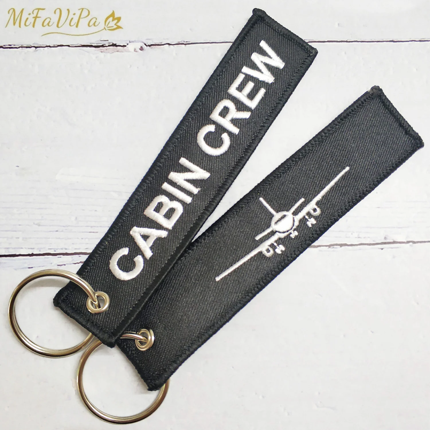 2 uds MiFaViPa negro blanco cabina tripulación Llaveros moda baratija aviación regalo Llavero oro avión bordado Llaveros Porte Clef