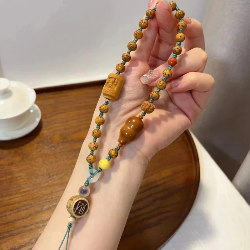 

New Gold Seed Xingyue Phone Accessory With Olive Nut Gourd Bone Fortune And Other
