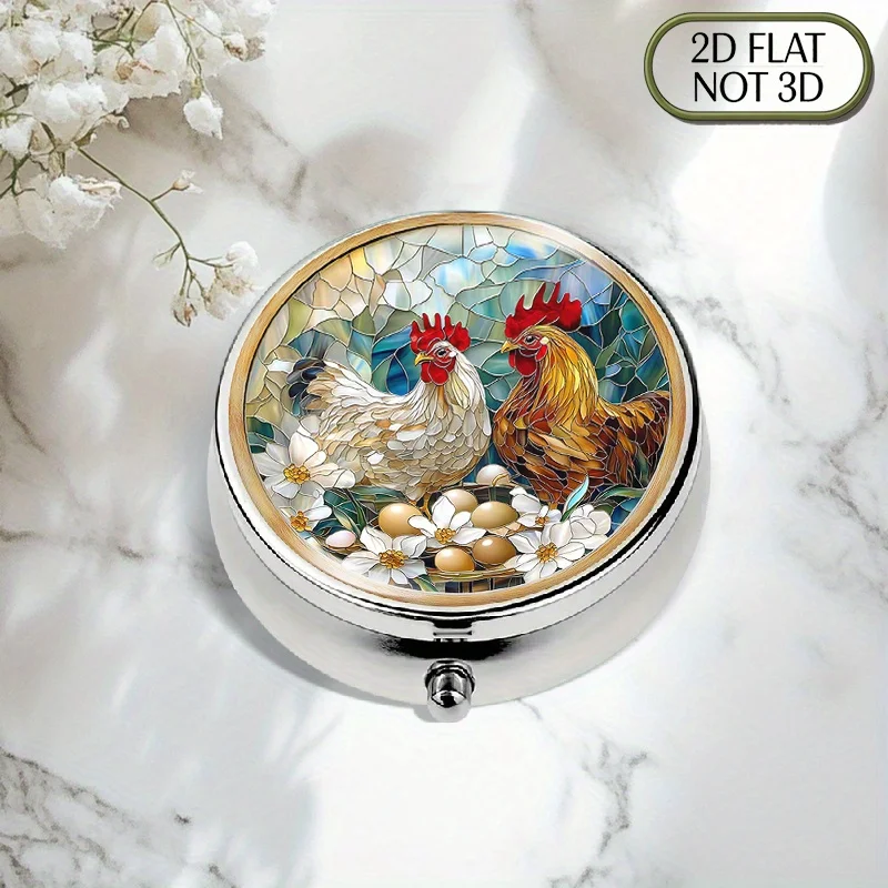 A flat, portable, round metal pill box, decorated with a vibrant, colorful glass rooster design and floral details, is ideal for organized medication storage. Its elegant design makes it perfect for storing vitamins and other items, and it is an excellent gift for thoughtful individuals or for travel