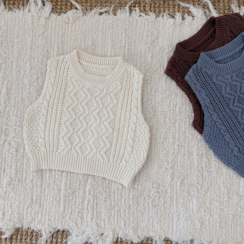ربيع جديد 2026 ملابس أطفال من عمر 0 إلى 3 سنوات سترة حياكة للأطفال الأولاد والبنات سترة لحديثي الولادة بدون أكمام بلون واحد #1