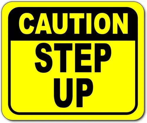 Caution step up watch your step Bright yellow metal outdoor sign