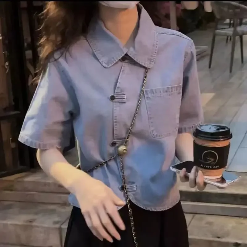 

Denim shirt female autumn 2024 fashion retro cheongsam buckle slim and versatile design fashion niche shirt short sleeve top.