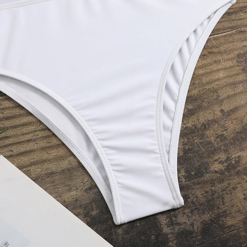 Traje de baño Sexy de Color sólido para mujer, traje de baño de retazos de malla de una pieza, ropa de playa de un hombro con volantes a la moda