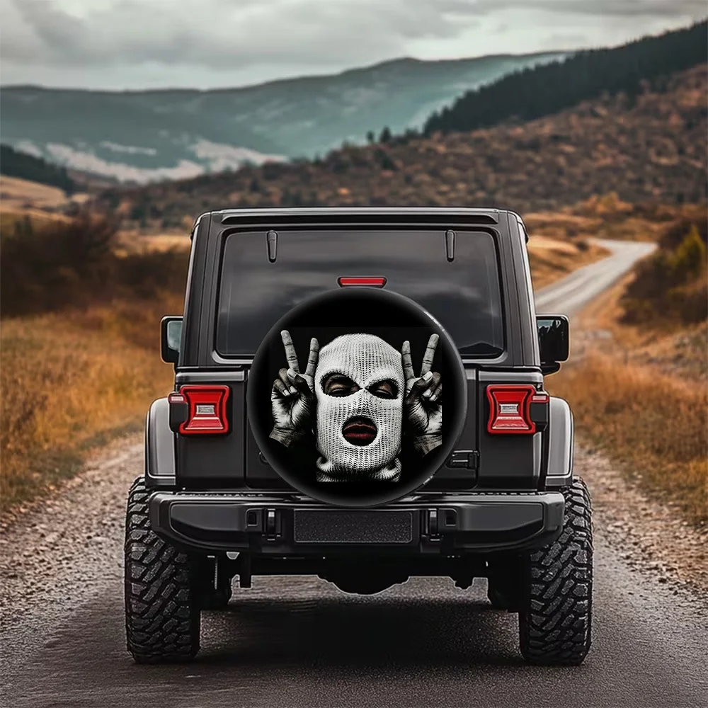 A Stylish Patterned Tire Cover With Unique Masked Gestures, Designed For Universal Fit, Perfect For Protecting Spare Tires, Easy