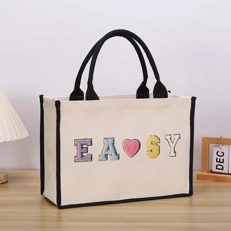 

Large capacity men's handbag canvas letter print hand-held gift shopping bag daily outing commuting bag