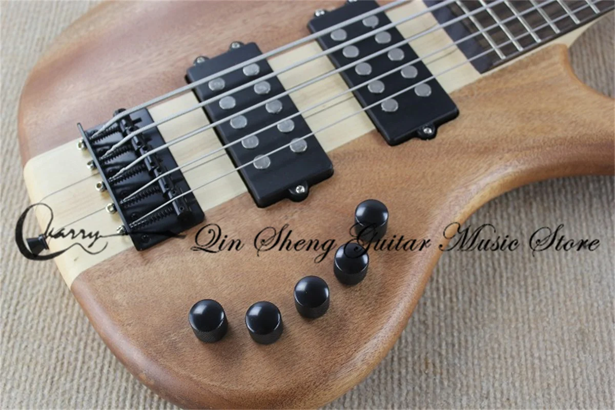 

5 strings bass guitar,W matte natural bass ,maple neck through mahogany body,rosewood veneer,black bridge,active battery