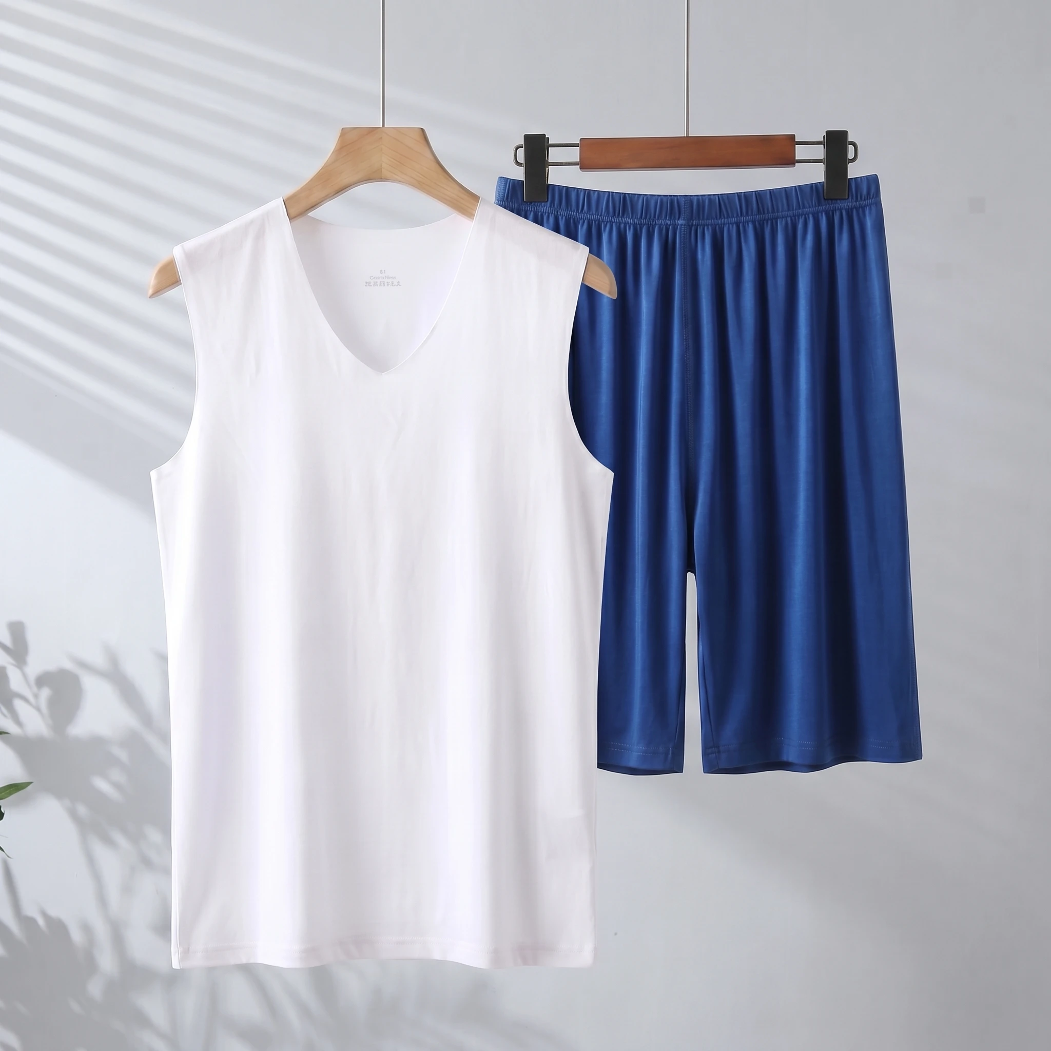White vest + dark blue shorts