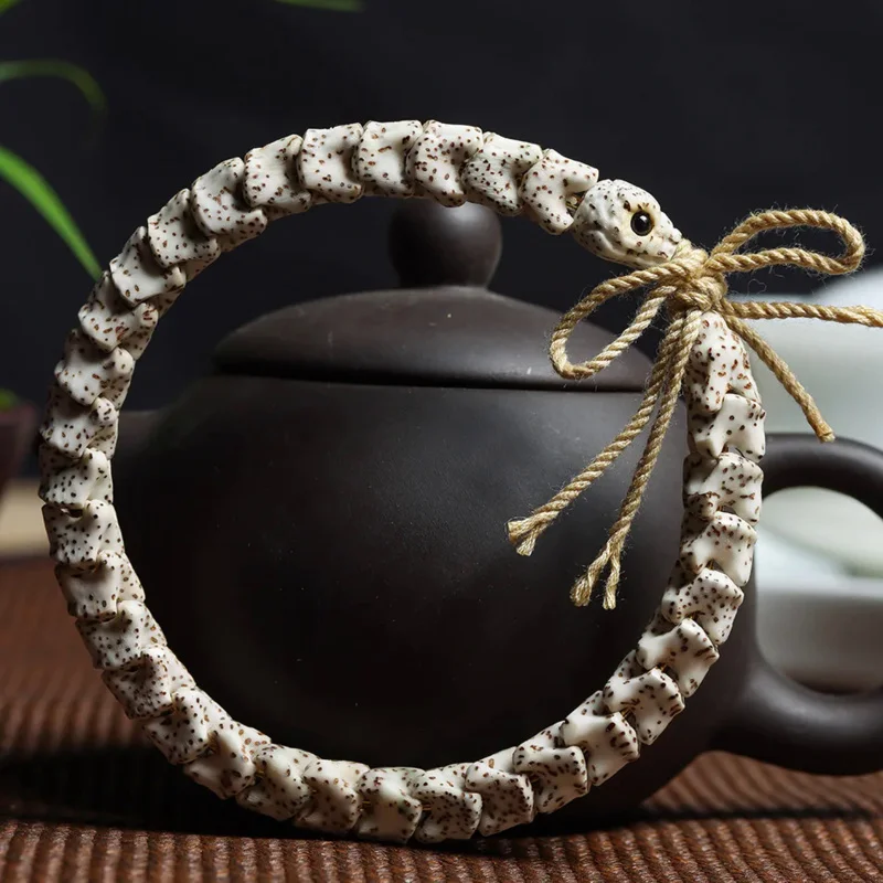 

Hainan Star Moon Bodhi Exquisite Sculpture Snake Bone Hand Chain and White Stone Jade Shunbai Wen Playing Bead