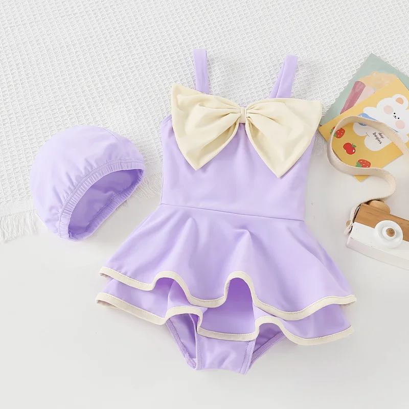 Bañador de una pieza para niña pequeña, traje de baño de seda suave con lazo, vestido de pastel, ropa de baño para bebé, conjunto de gorro de baño