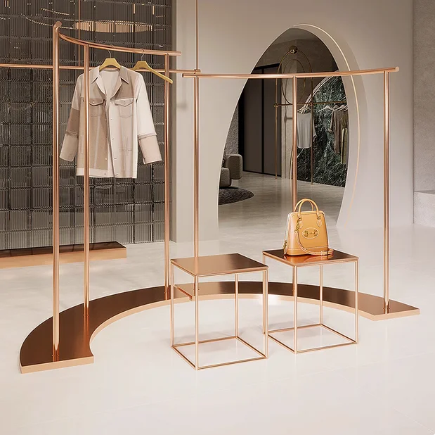 

Stainless steel rose gold hanging clothes rack, women's clothing store curved island display shelf