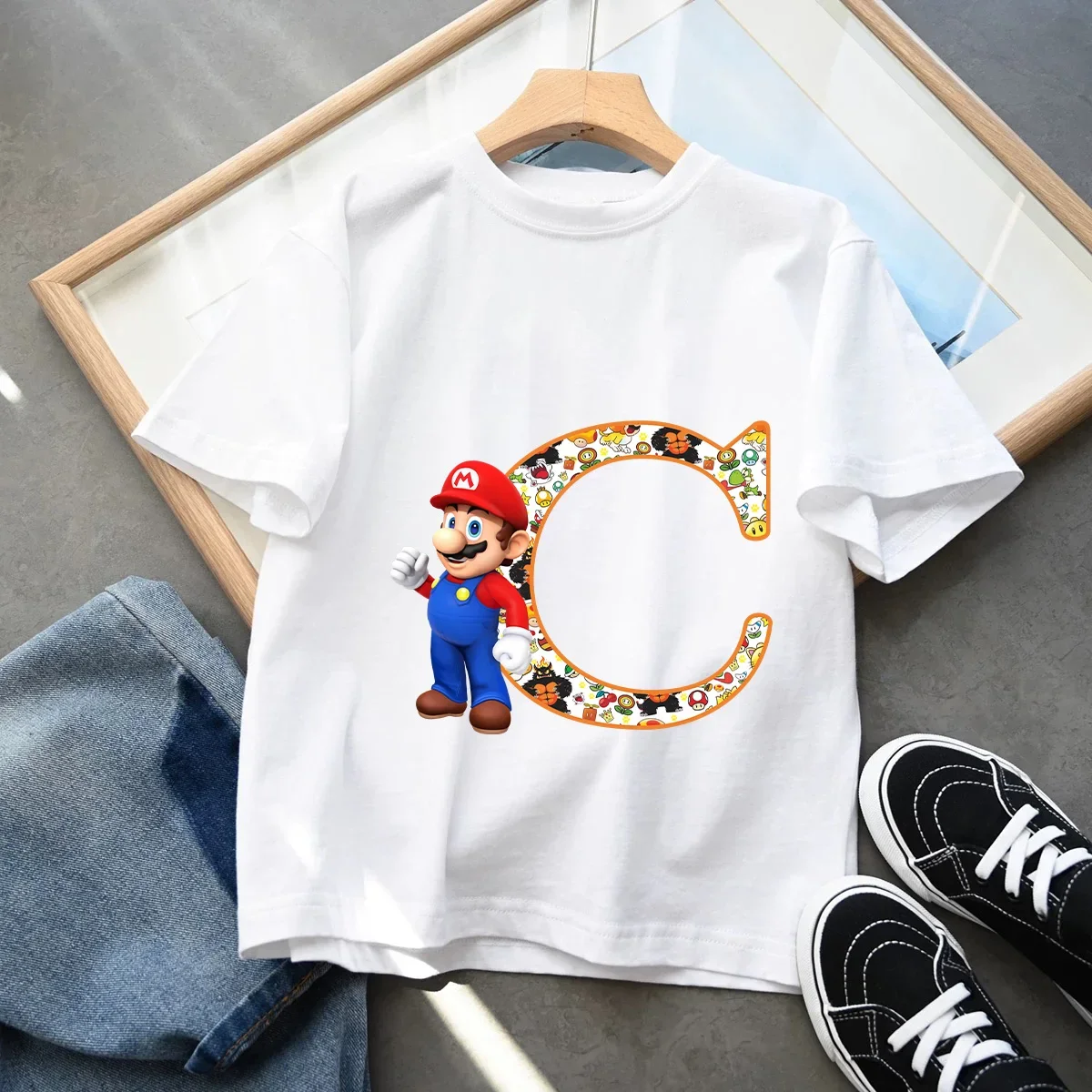 

2026 Super Mario Boys and Girls Cartoon letter A-Z Printed Birthday Clothing Children's Fashion Short Sleeve Role Playing Top