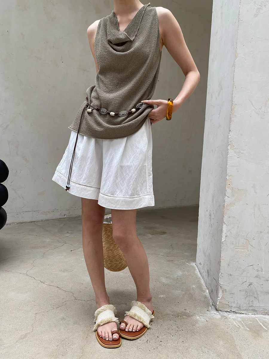 Sommerliche Damen-Shorts in unifarbenem Design mit hohler Textur, elastischem, hohem Bund, schlank machendem und lockerem, weitem Bein. – Detail 5