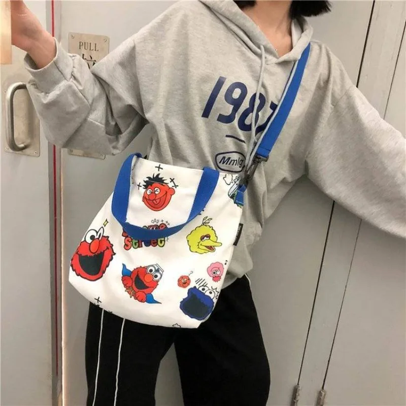 Sesame Street animation peripheral cartoon cute student large capacity canvas tote bag creative personalized crossbody handbag