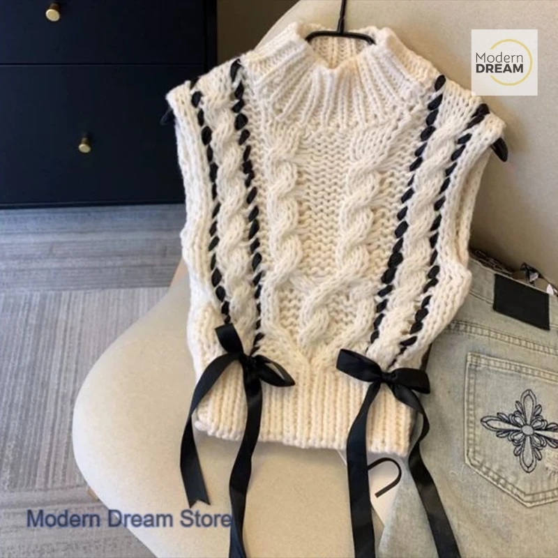 Gilet lavorato a maglia a collo mezzo alto da ragazza speziata dolce in stile coreano, design di nicchia autunnale e invernale da donna con top senza maniche con fiocco.