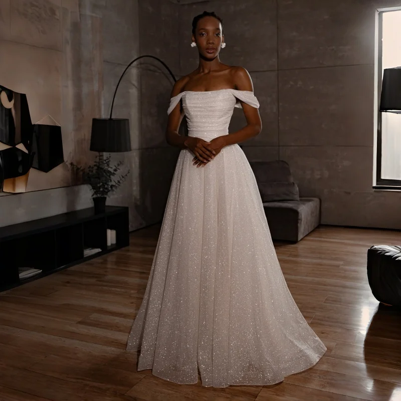 

Minimalist Luxe Bridal A-Line Skirt Gown Off-The-Shoulder Neck With Cuffed Sleeves Ruched Sparkle Bodice Customizable