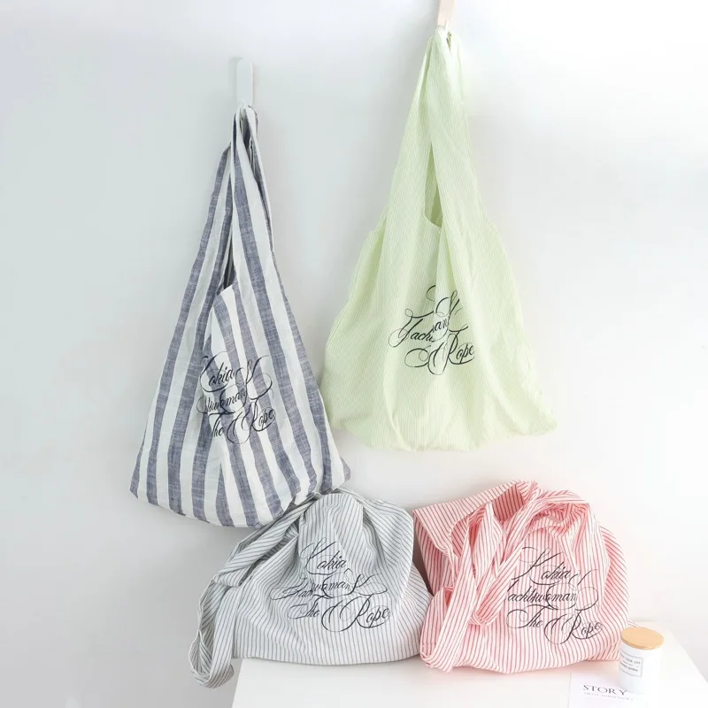 

Korean Style Niche Design Fashion Striped Letter Canvas Bag Large Capacity Commuting Fashion Versatile Shoulder Bag Tote Bag