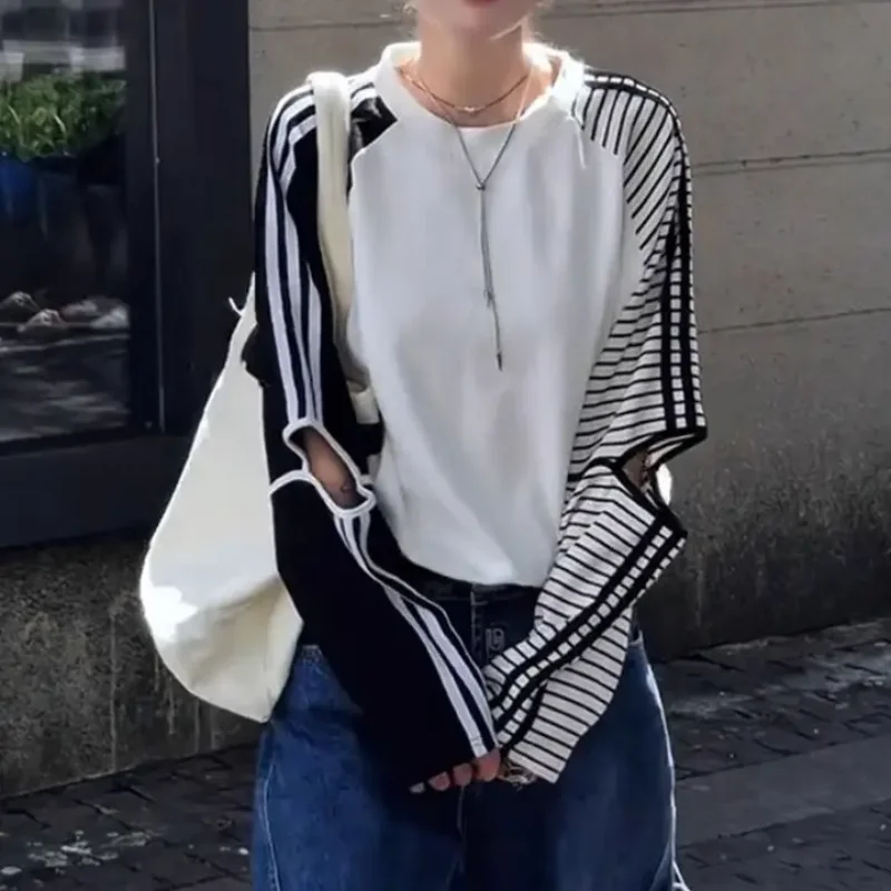 

American retro spicy girl color blocking fake two-piece striped hollowed out women's long sleeved t-shirt loose women's top