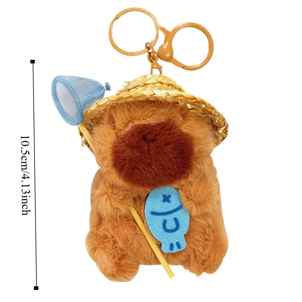 พวงกุญแจคาปิบาราถือตาข่ายจับปลา ตุ๊กตาคาปิบาราใส่กระเป๋า  ทำจากผ้าฝ้าย PP  รูปการ์ตูนสัตว์ตลก สำหรับเด็ก