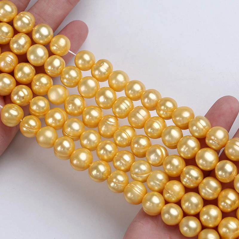 

Жемчуг натуральный 10-11 мм, золотистый, на нити, оптом