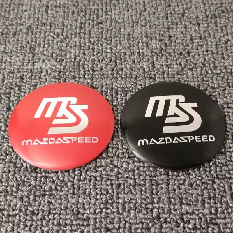 60 مللي متر 65 مللي متر سيارة عجلة مركز محور قبعات ملصق لمازدا MS 3 6 GH Atenza CX5 CX5 CX3 CX9 RX7 RX8 Axela اكسسوارات السيارات الخارجية